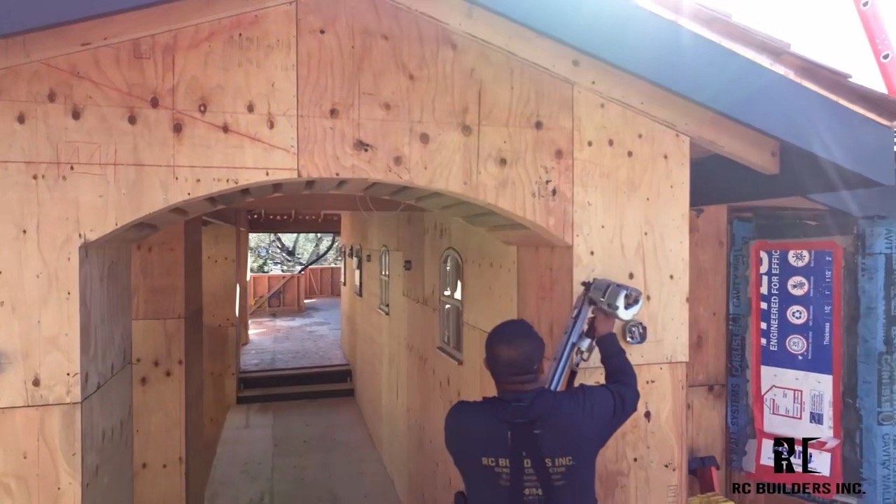 Framing an arched opening Carpenter framing a custom arched interior opening on an RC Builders job site